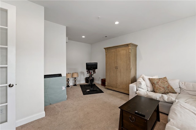 living room featuring light carpet