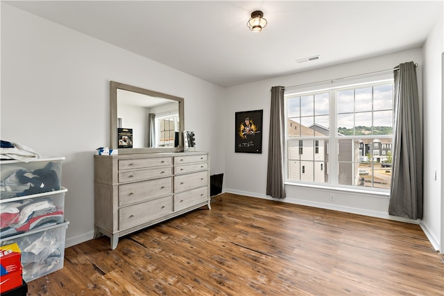 bedroom with hardwood / wood-style floors