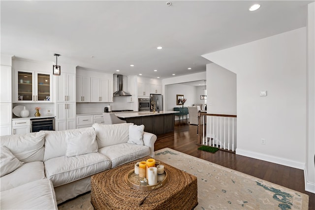 living room featuring dark hardwood / wood-style floors and beverage cooler