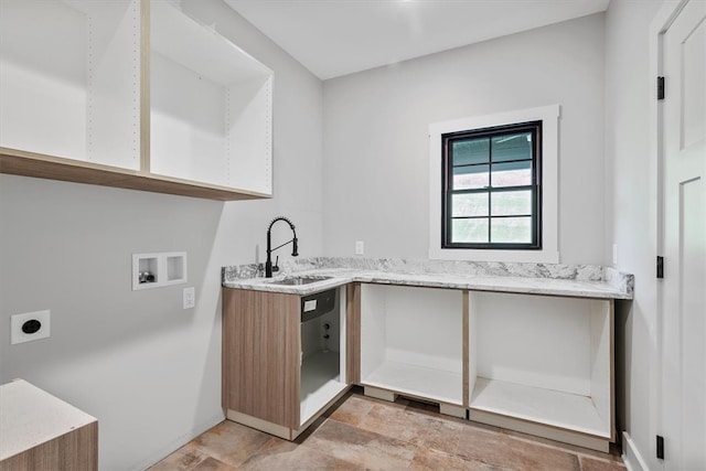 laundry room featuring hookup for an electric dryer, washer hookup, cabinets, and sink