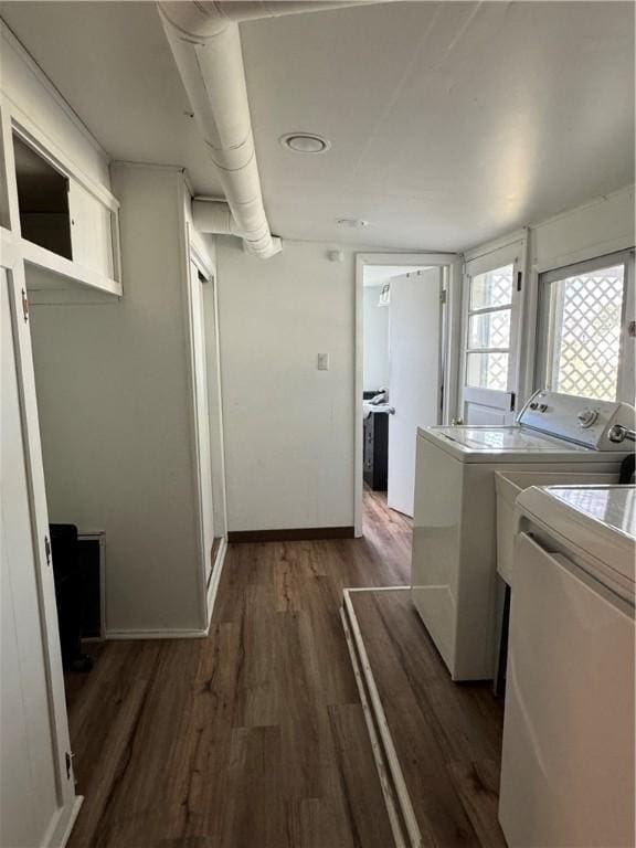 washroom featuring washer and dryer and dark hardwood / wood-style floors