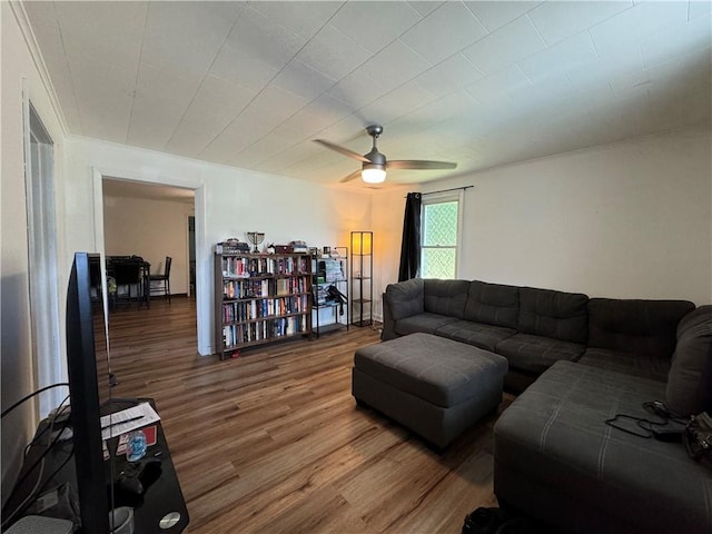 living room featuring hardwood / wood-style flooring and ceiling fan