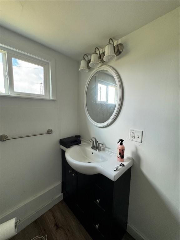 bathroom featuring hardwood / wood-style floors and vanity