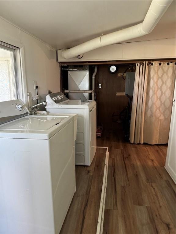 washroom with washer and dryer and dark hardwood / wood-style floors