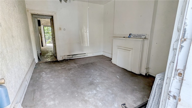 spare room with concrete floors and a baseboard radiator