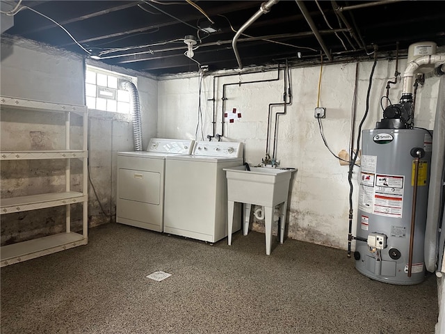 laundry room with separate washer and dryer and water heater