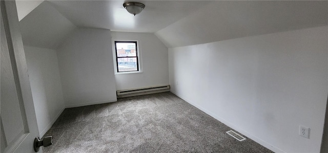 additional living space with carpet, a baseboard radiator, and lofted ceiling