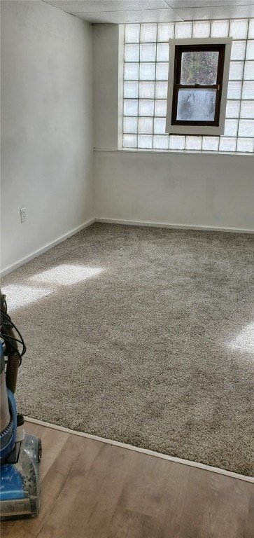 empty room featuring wood-type flooring