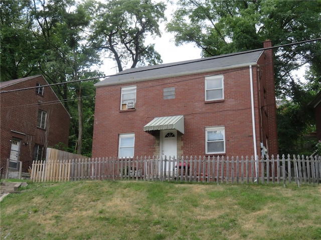 view of front of home with a front lawn