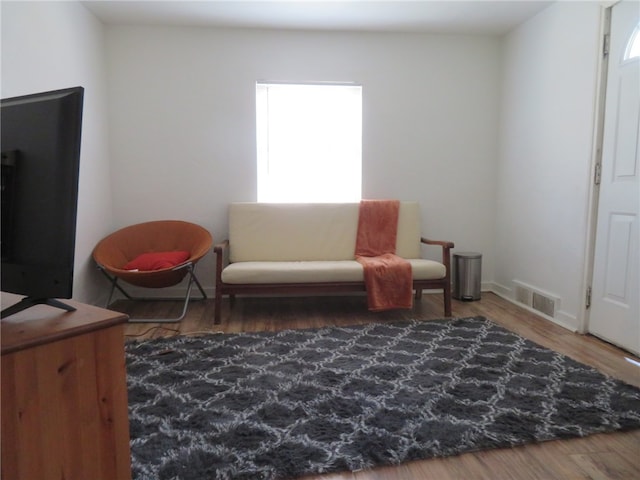 sitting room featuring hardwood / wood-style floors