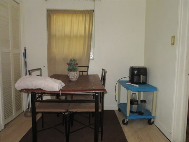 dining space featuring hardwood / wood-style floors