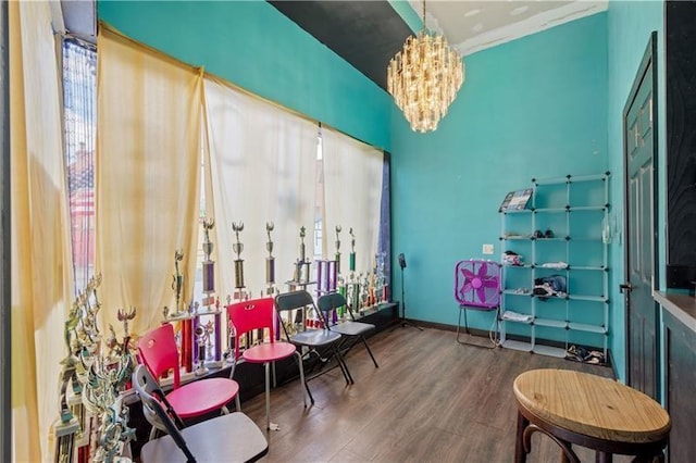 interior space with an inviting chandelier and hardwood / wood-style flooring