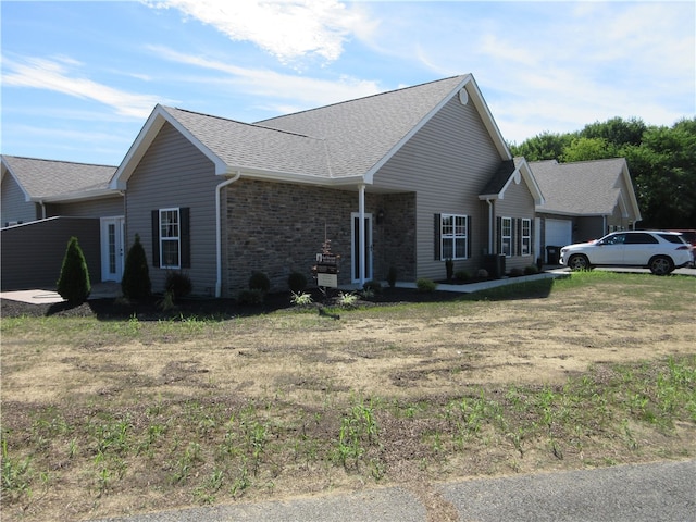 view of side of home with a yard