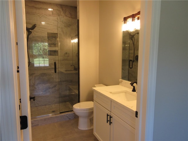 bathroom featuring vanity, an enclosed shower, tile patterned flooring, and toilet