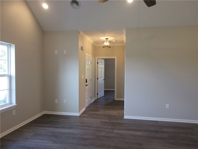 unfurnished room with dark hardwood / wood-style floors, crown molding, and ceiling fan