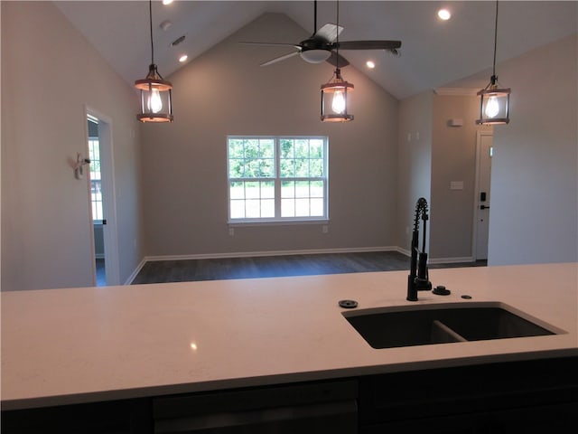 kitchen with sink, pendant lighting, high vaulted ceiling, dark wood-type flooring, and ceiling fan