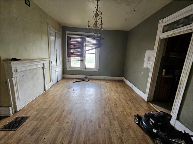 unfurnished dining area featuring light hardwood / wood-style flooring