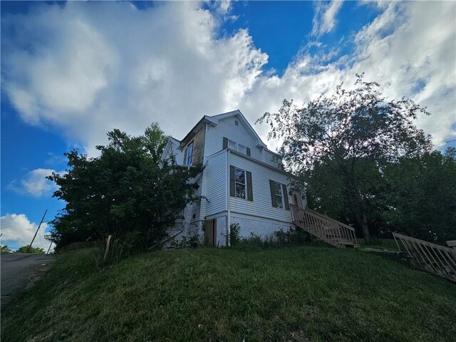 view of property exterior featuring a yard