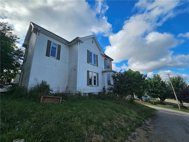 view of home's exterior featuring a lawn