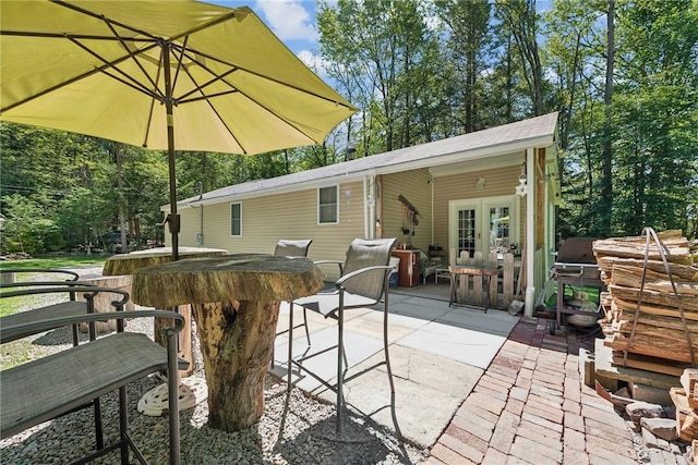 view of patio / terrace with french doors and an outdoor bar