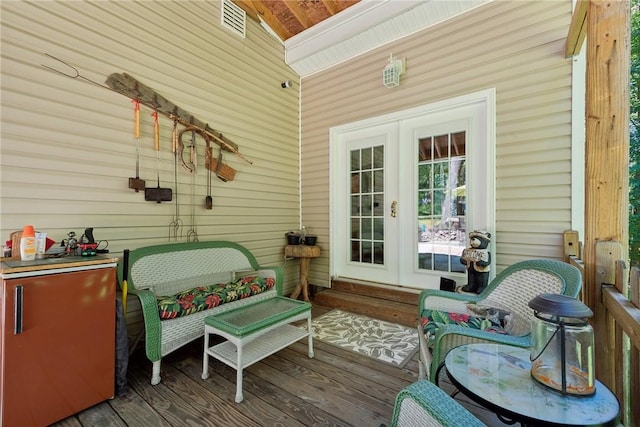 deck with an outdoor bar and french doors