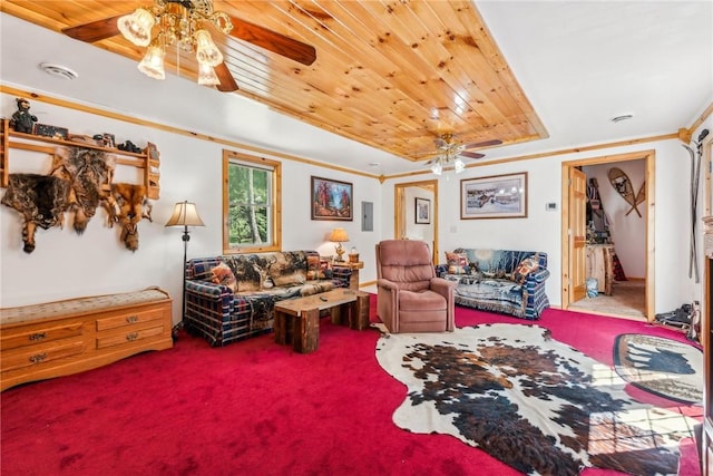 living room with ceiling fan, wooden ceiling, a tray ceiling, and carpet flooring