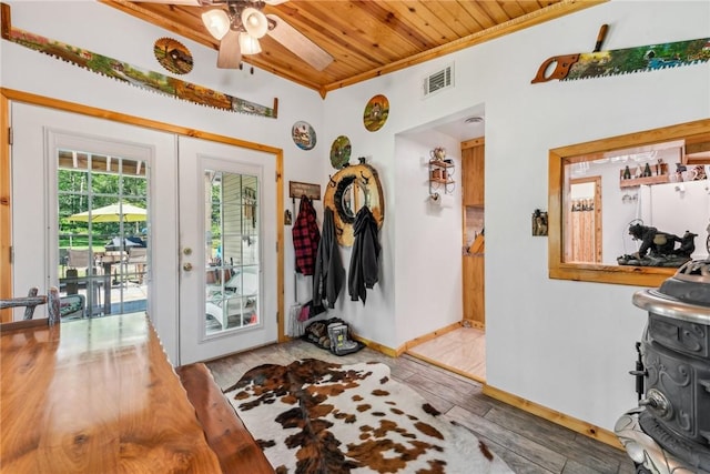 doorway with hardwood / wood-style floors, wood ceiling, french doors, ceiling fan, and crown molding