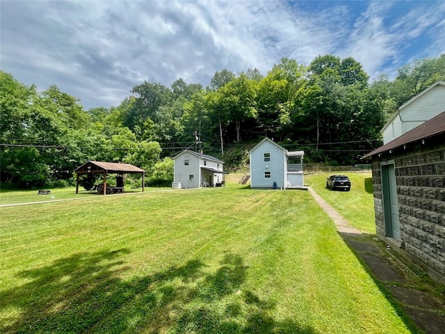 view of yard featuring an outbuilding and a gazebo