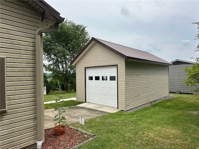 garage featuring a yard