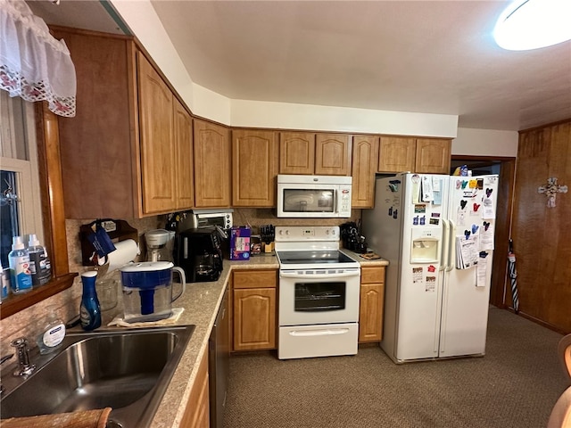 kitchen featuring sink and white appliances