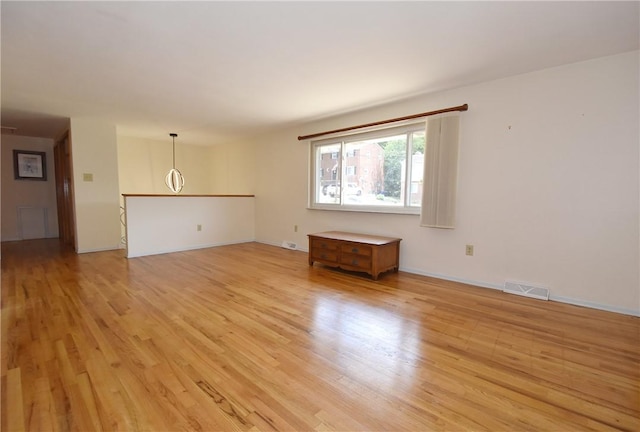 unfurnished living room featuring light hardwood / wood-style flooring