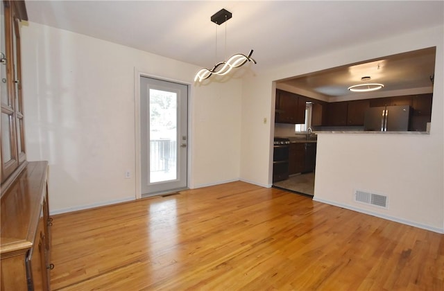 interior space with sink and light hardwood / wood-style floors