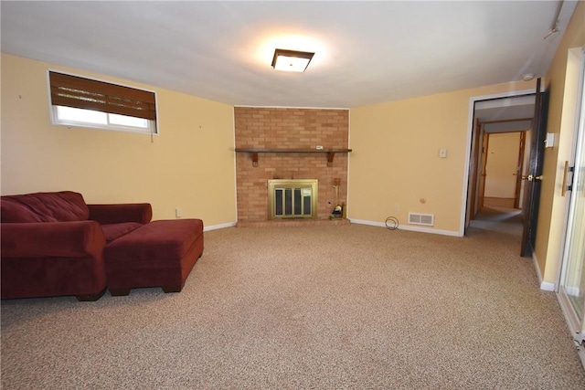 living room with carpet floors and a brick fireplace