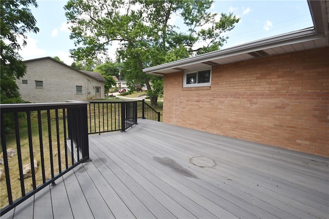 wooden deck with a yard