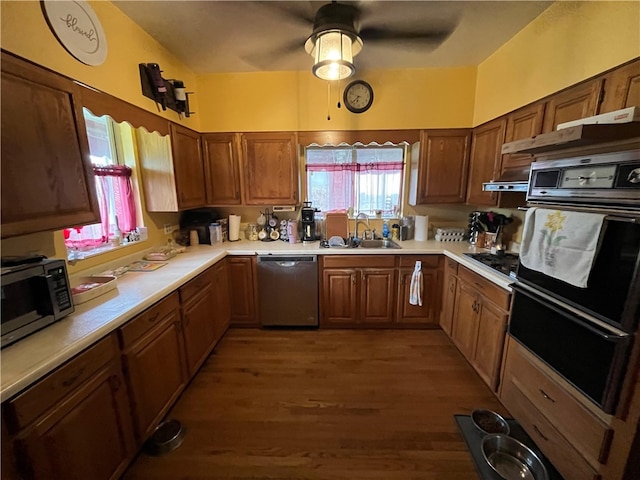 kitchen with sink, black appliances, ceiling fan, and hardwood / wood-style floors