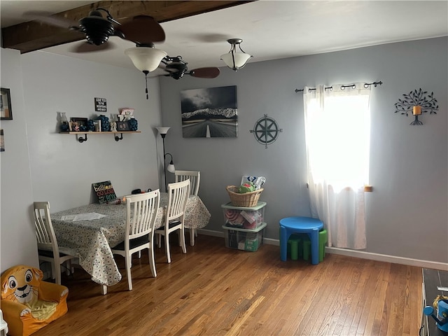 dining room with ceiling fan and hardwood / wood-style floors