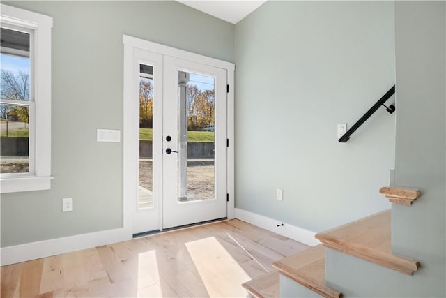 doorway with light hardwood / wood-style floors