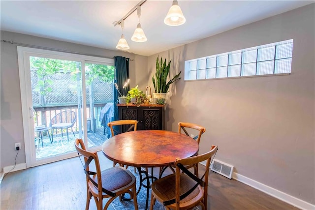 dining room with hardwood / wood-style floors