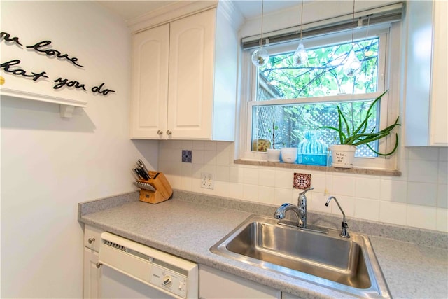 kitchen featuring dishwasher, pendant lighting, tasteful backsplash, and white cabinets