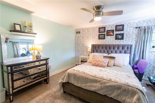 bedroom with wood-type flooring and ceiling fan