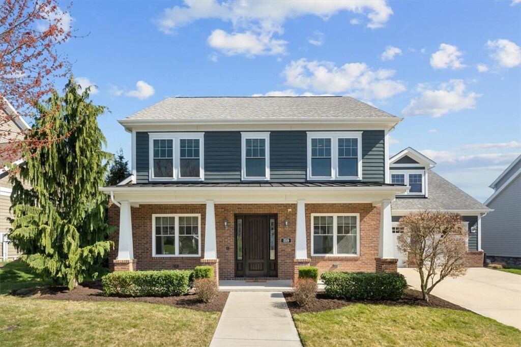 1519 Celebration Crk, South Fayette, PA 15017 - view of front facade with a front yard and a porch
