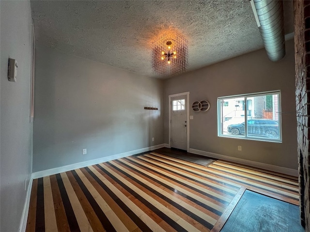 foyer with a textured ceiling