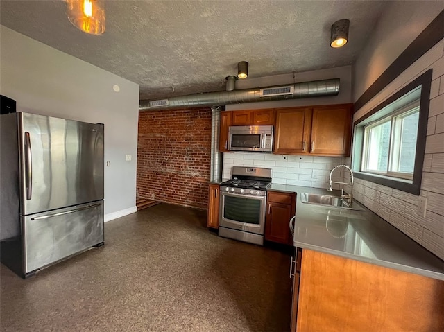 kitchen featuring decorative backsplash, a wood stove, appliances with stainless steel finishes, and sink