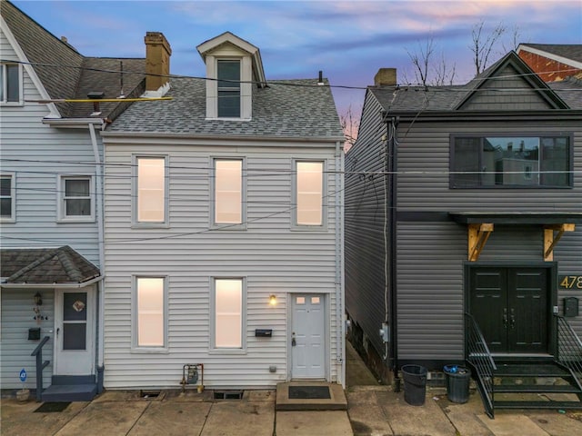 view of front of house with a patio area