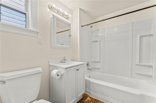 full bathroom featuring shower / tub combination, vanity, and toilet