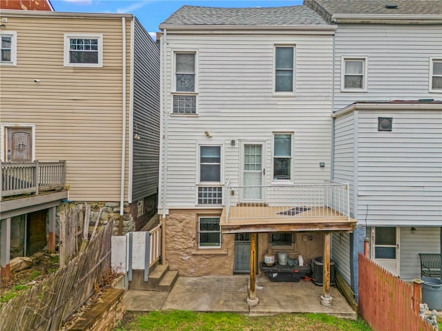 rear view of property featuring a patio