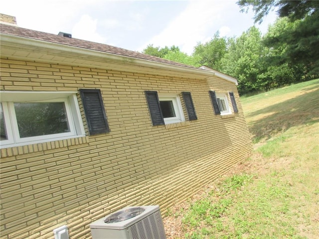 view of home's exterior with central AC unit