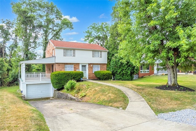 view of front of home featuring a garage and a front lawn