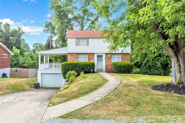 view of front of house with a garage and a front yard