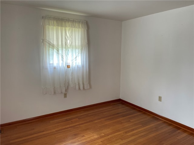 spare room featuring hardwood / wood-style flooring